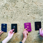 Hands and passports from different countries