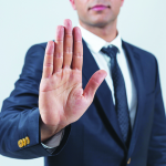 Businessman showing stop with hand